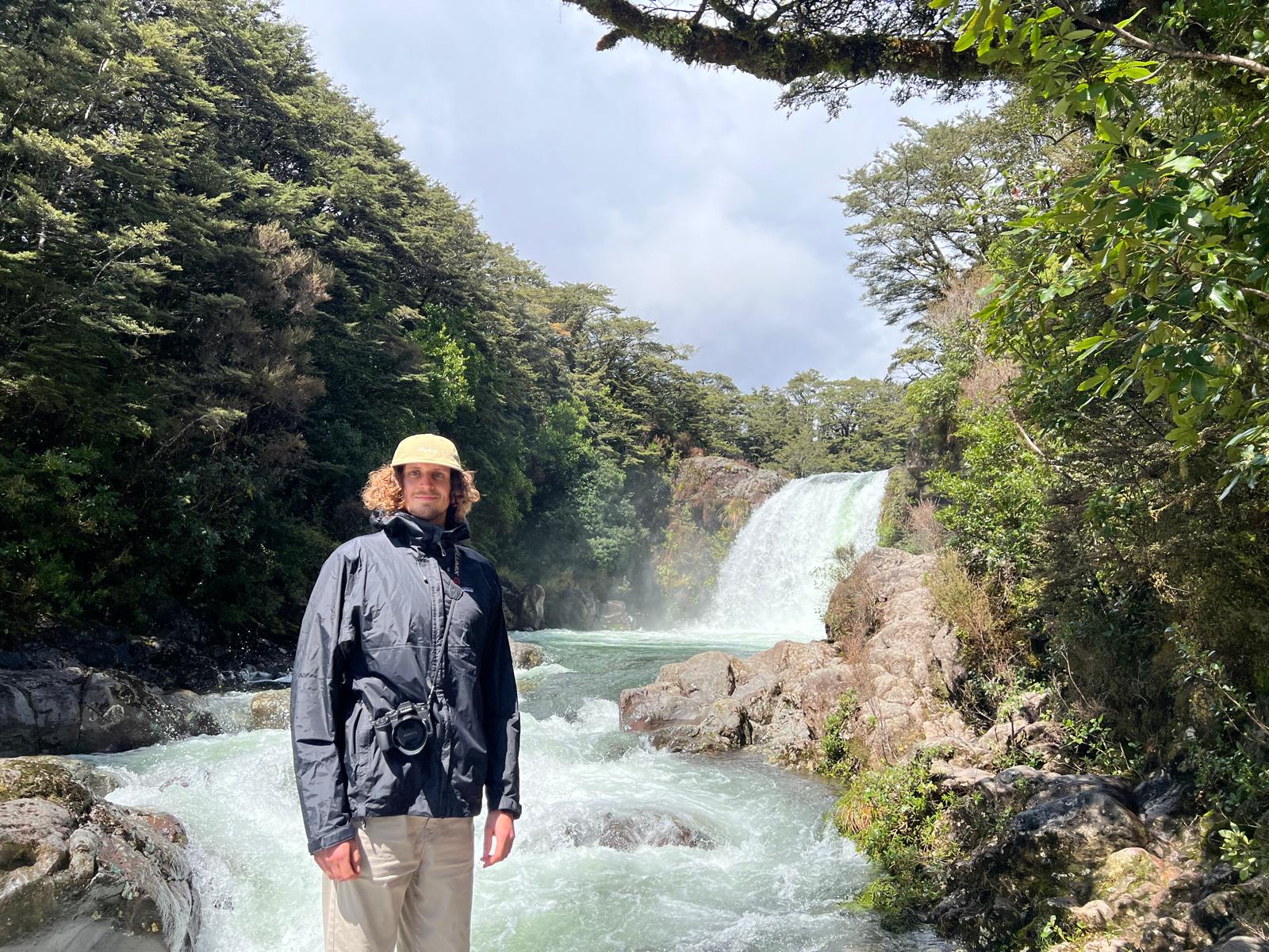 Daan Lichtenberg in the field, beside a waterfall